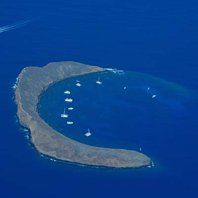 Swim and snorkel in a flooded, extinct volcano crater and enjoy a BBQ lunch as you relax onboard.