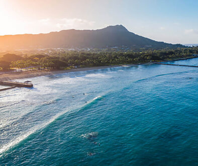 Sunrise Waikiki Beach with Diamond Head in view for budget Hawaii travel