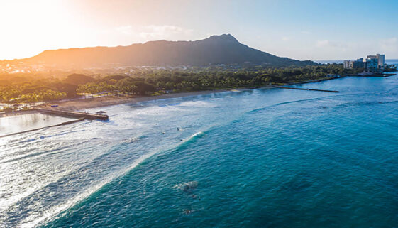 Sunrise Waikiki Beach with Diamond Head in view for budget Hawaii travel